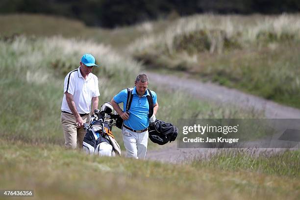 Nigel Perry and partner Miles Davidson of Abbeydale GC make their way down the fairway during The Lombard Trophy - North West Qualifier at Formby...