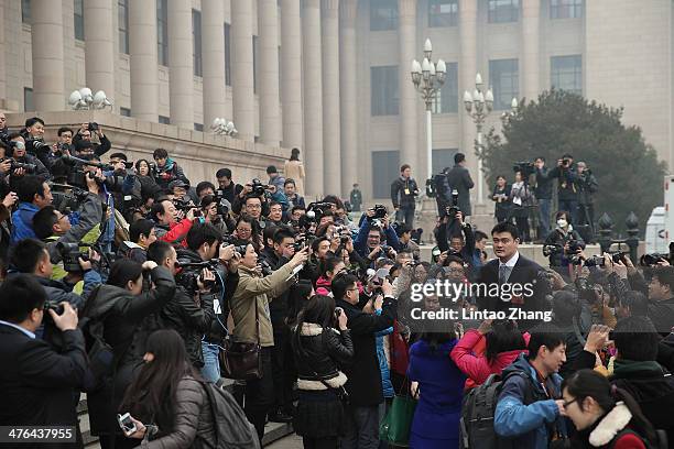 Delegate Yao Ming , a former NBA basketball star, attends the opening session of the Chinese People's Political Consultative Conference held at the...