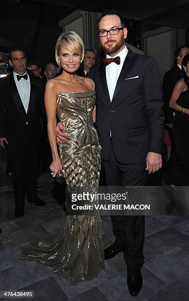 American singer Kristin Chenoweth arrives with Dana Brunetti at the Governor's Ball following the 86th Academy Awards on March 2nd, 2014 in...