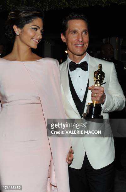 Best Actor Oscar winner Matthew McConaughey and wife Camila Alves arrive at the Governor's Ball following the 86th Academy Awards on March 2nd, 2014...