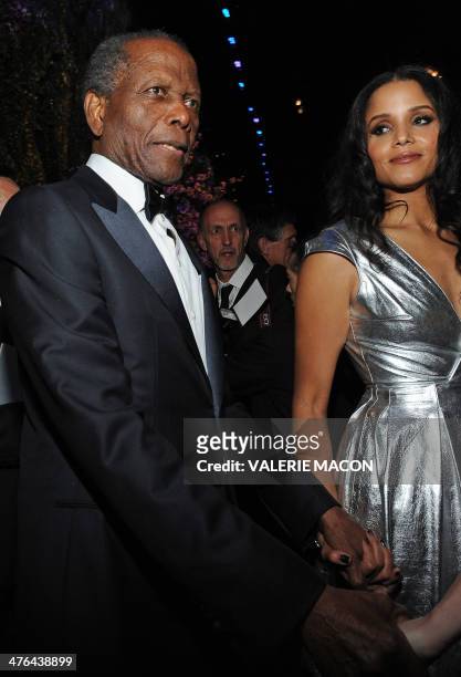 Actor Sidney Poitier arrives with one of his daughters at the Governor's Ball following the 86th Academy Awards on March 2nd, 2014 in Hollywood,...
