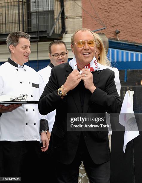 Michael Kors appears onstage during the celebration of God's Love We Deliver returning to Soho with a dedication of the new Michael Kors building on...