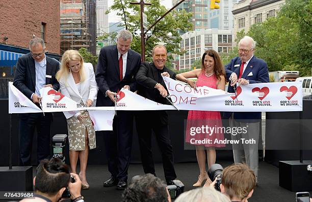 Scott Bruckner, Blaine Trump, Mayor Bill de Blasio, Michael Kors, Karen Pearl and Michael Sennott cut the ribbon during the celebration of God's Love...