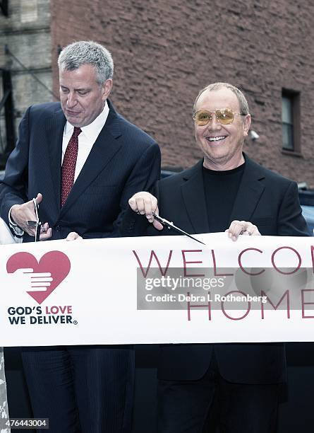 Mayor Bill de Blasio and Michael Kors attend the celebration of God's Love We Deliver returning to Soho with a dedication of the new Michael Kors...