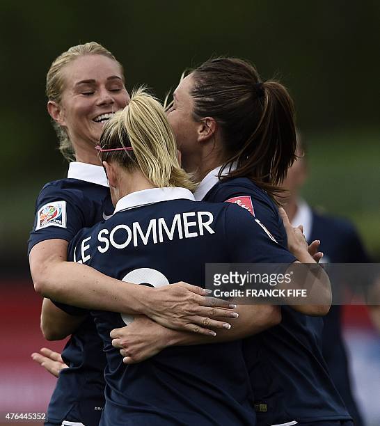 France's forward Eugenie Le Sommer is congratuled by teammates after scoring a goal during a Group F match at the 2015 FIFA Women's World Cup between...