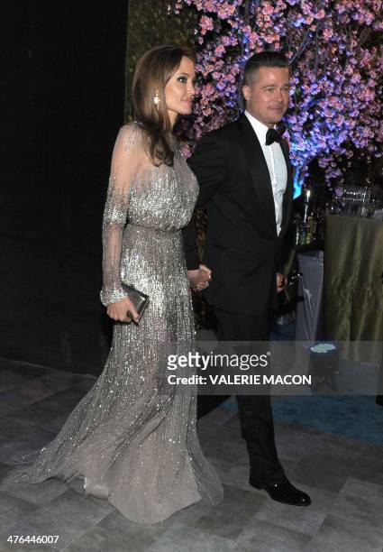 Actors Angelina Jolie and Brad Pitt arrive at the Governor's Ball following the 86th Academy Awards on March 2nd, 2014 in Hollywood, California. AFP...