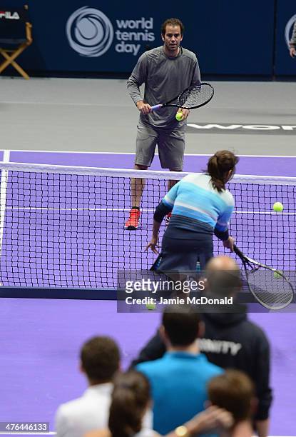 Pete Sampras gives advice during a tennis clinic during the World Tennis Day London Showdown press conference at the Athenaeum Hotel at Piccadilly on...