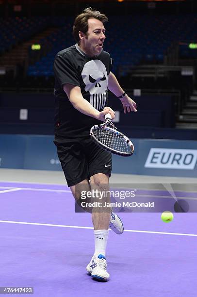 Johnathan Ross plays the ball during a tennis clinic during the World Tennis Day London Showdown press conference at the Athenaeum Hotel at...