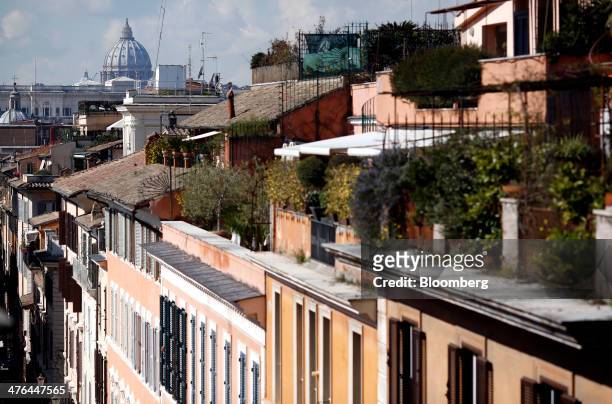 The dome of St. Peter's Basilica is seen beyond residential property in Rome, Italy, on Monday, March 3, 2014. Italian Prime Minister Matteo Renzi is...