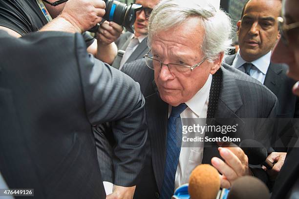 Former Republican Speaker of the House Dennis Hastert fights his way through the press as he arrives for his arraignment at the Dirksen Federal...