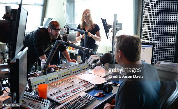 Recording Lee Brice answers a phone in question at SiriusXM Studios on June 9, 2015 in Nashville, Tennessee.