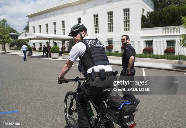 Secret Service stand outside the West Wing following an evacuation of the press from the Press Briefing Room at the White House in Washington, DC,...