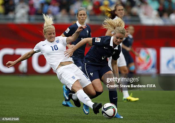 Katie Chapman of England challenges for the ball with Amandine Henry of France during the FIFA Women's World Cup 2015 Group F match between France...