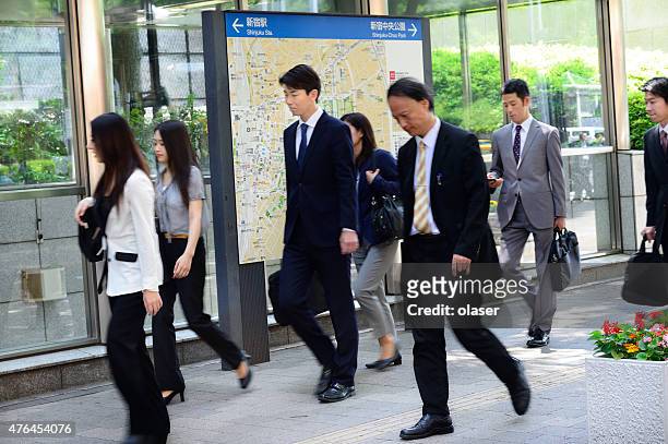 commuters entering subway system in tokyo - japanese exit sign stock pictures, royalty-free photos & images