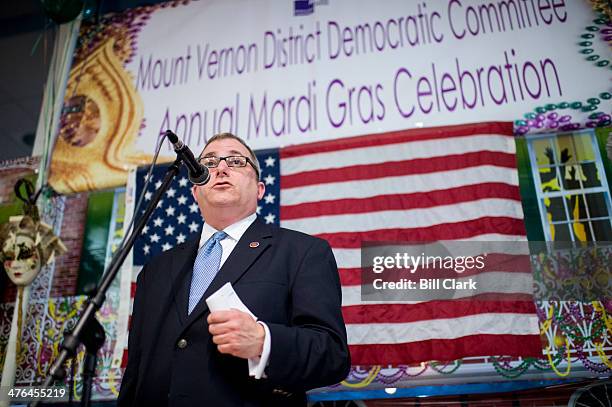 State Senator Adam Ebbin speaks during the Mount Vernon District Democratic Committee's annual Mardi Gras fundraiser at Don Beyer's Volvo car...