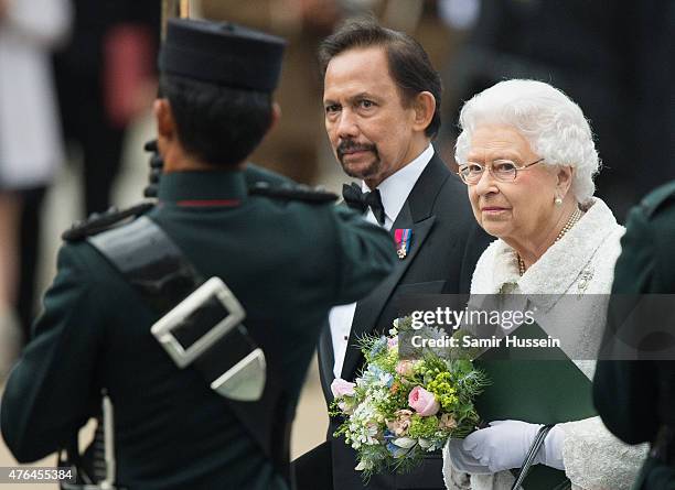 Queen Elizabeth II and The Sultan of Brunei attend the Gurkha 200 pageant at Royal Hospital Chelsea on June 9, 2015 in London, England.