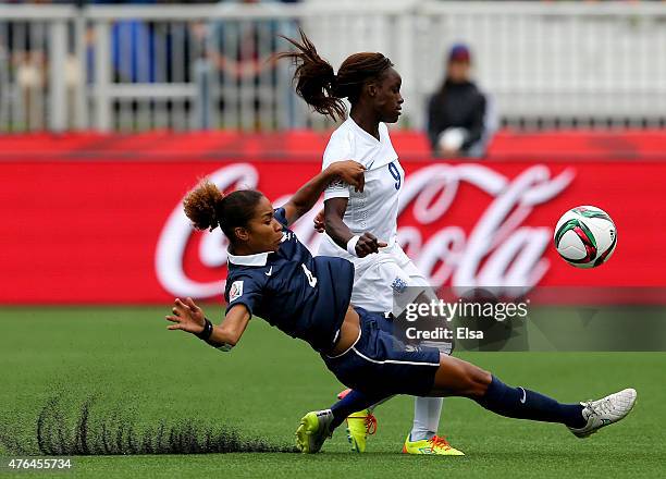 Eniola Aluko of England and Laura Georges of France fight for the ball during the FIFA Women's World Cup 2015 Group F match at Moncton Stadium on...