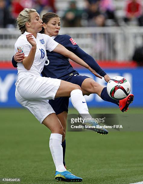 Toni Duggan of England challenges for the ball with Laure Boulleau of France during the FIFA Women's World Cup 2015 Group F match between France and...