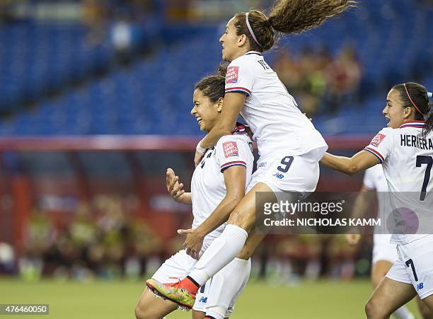 Costa Rica's Raquel Rodriguez celebrates scoring against Spain with Carolina Venegas and Melissa Herrera during a Group E match at the 2015 FIFA...
