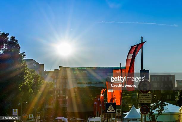 sun star red flags blue sky outdoor trees urban - wepix stock pictures, royalty-free photos & images