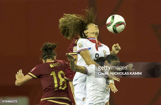Costa Rica's Carolina Venegas and Shirley Cruz fight for a header with Spain's Marta Torrejon during a Group E match at the 2015 FIFA Women's World...