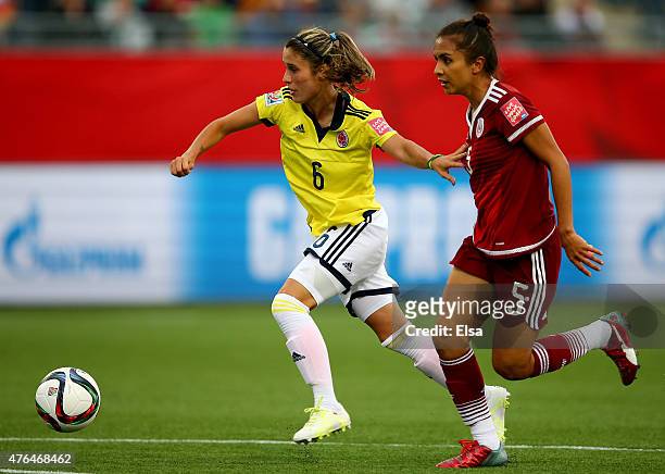 Daniela Montoya of Colombia and Valeria Miranda of Mexico fight for the ball in the second half during the FIFA Women's World Cup 2015 Group F match...