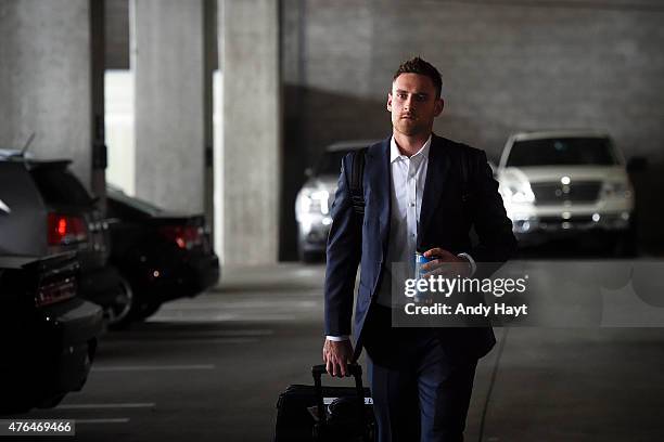 Will Middlebrooks of the San Diego Padres walks his luggage to a transport truck on a travel day to Cincinnatti, Ohio at Petco Park on June 4, 2015...