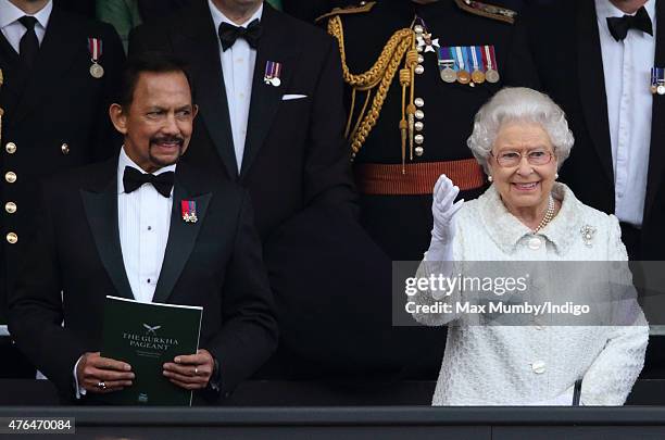 The Sultan of Brunei, Hassanal Bolkiah and Queen Elizabeth II attend the Gurkha 200 Pageant at the Royal Hospital Chelsea on June 9, 2015 in London,...