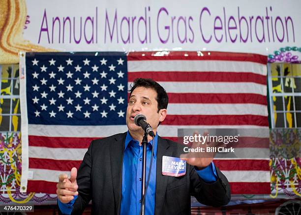 Mark Levine, The Aggressive Progressive, speaks during the Mount Vernon District Democratic Committee's annual Mardi Gras fundraiser at Don Beyer's...