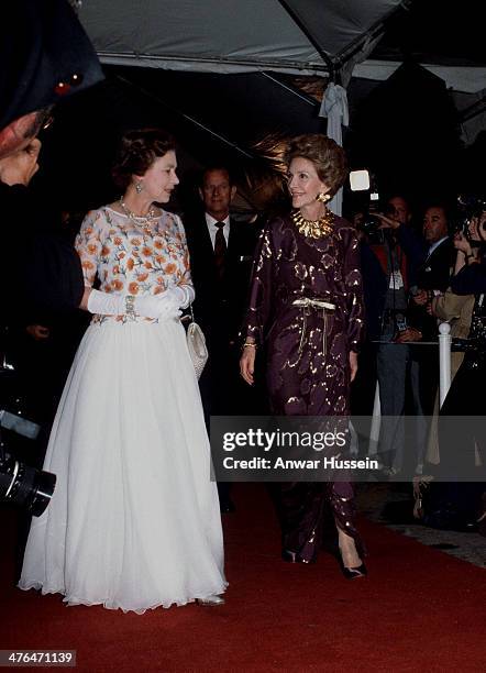 Queen Elizabeth ll and Nancy Reagan arrive for a concert during an official Tour of the USA on February 28, 1983 in Long Beach, USA.