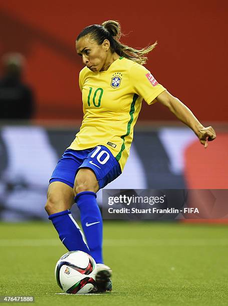 Marta of Brazil scores her panalty goal during the FIFA Women's World Cup 2015 group E match between Brazil and Korea Republic at Olympic Stadium on...