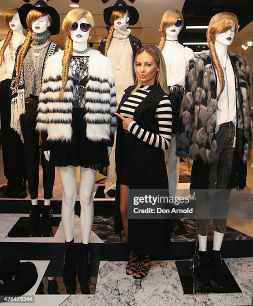 Samantha Jade poses alongside mannequins at the opening of the 'FOREVER 21' flagship store on Pitt Street on June 10, 2015 in Sydney, Australia.