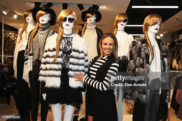 Samantha Jade poses alongside mannequins at the opening of the 'FOREVER 21' flagship store on Pitt Street on June 10, 2015 in Sydney, Australia.