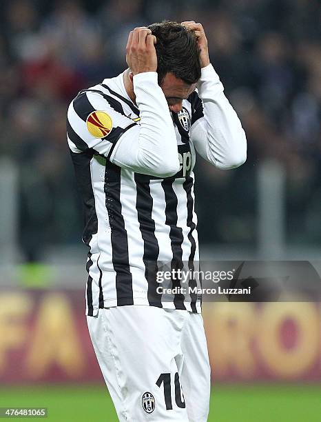 Carlos Tevez of Juventus FC reacts to a missed chance during the UEFA Europa League Round of 32 match between Juventus and AS Trabzonspor at Juventus...