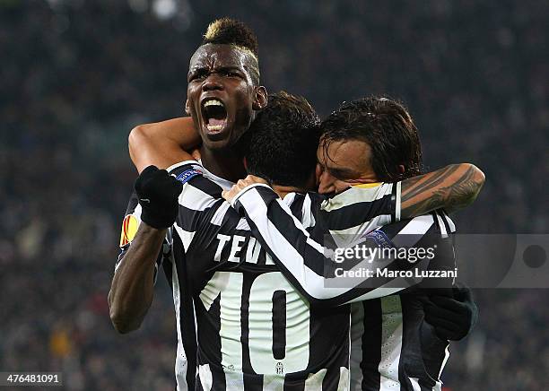 Paul Pogba of Juventus FC celebrates with his team-mates Carlos Tevez and Andrea Pirlo during the UEFA Europa League Round of 32 match between...