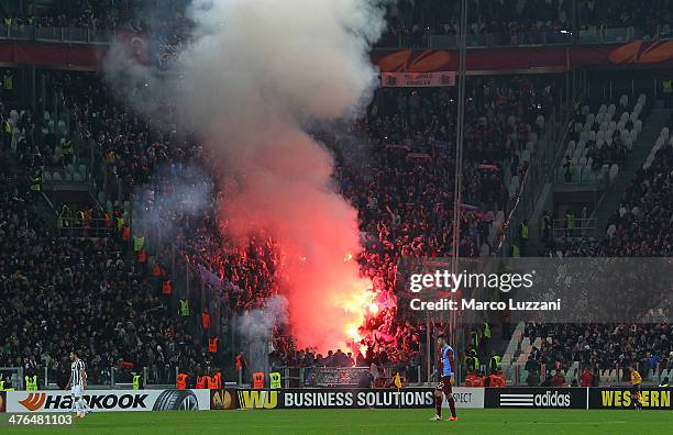 The AS Trabzonspor fans show their support during the UEFA Europa League Round of 32 match between Juventus and AS Trabzonspor at Juventus Arena on...