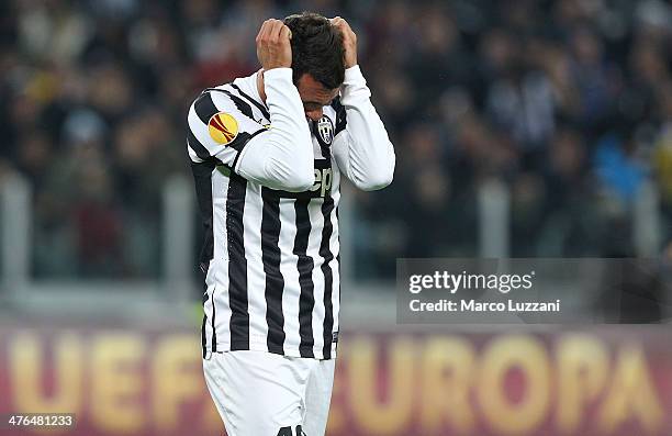 Carlos Tevez of Juventus FC reacts to a missed chance during the UEFA Europa League Round of 32 match between Juventus and AS Trabzonspor at Juventus...