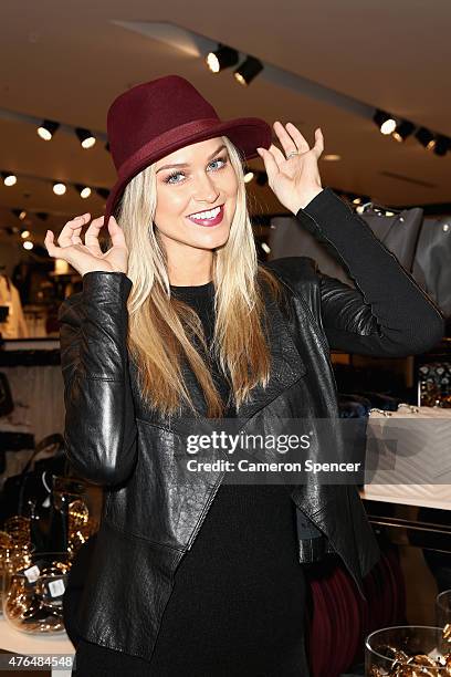 Renae Ayris poses wearing a 'FOREVER 21' hat inside the 'FOREVER 21' flagship store during its opening on Pitt Street on June 10, 2015 in Sydney,...