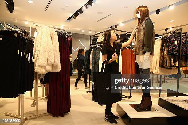 Person shops at the opening of the 'FOREVER 21' flagship store on Pitt Street on June 10, 2015 in Sydney, Australia.