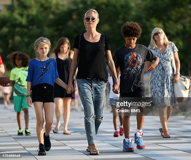 Heidi Klum enjoys summer in New York strolling with her children Leni and Henry on June 9, 2015 in New York City.