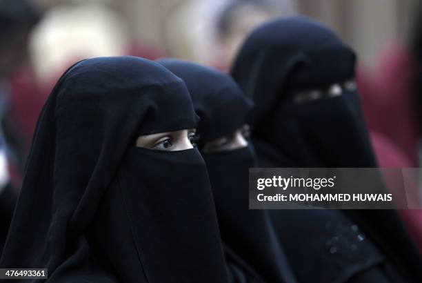 Yemeni women attend the showing of a film in Sanaa March 3, 2014 about "child brides", which are quite common in the poverty-striken and tribal...