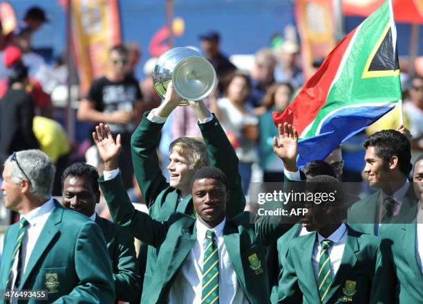 The South African U19 cricket world team parade their World Cup trophy on Day 3 of the third Test match between South Africa and Australia at...
