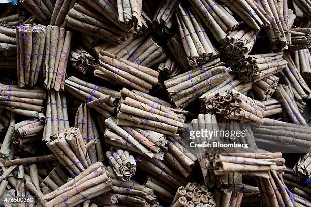 Bundles of bidi cigarettes sit at the Sarkar Bidi Factory in Kannauj, Uttar Pradesh, India, on Wednesday, June 3, 2015. India's smokers are favoring...