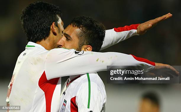 Bakhtiar Rahmani and Payam Sadeghian of Iran celebrate during the AFC Asian Cup Qualifier between Iran and Kuwait on March 3, 2014 in Tehran, Iran.