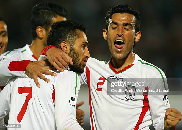 Bakhtiar Rahmani and Payam Sadeghian of Iran celebrate during the AFC Asian Cup Qualifier between Iran and Kuwait on March 3, 2014 in Tehran, Iran.