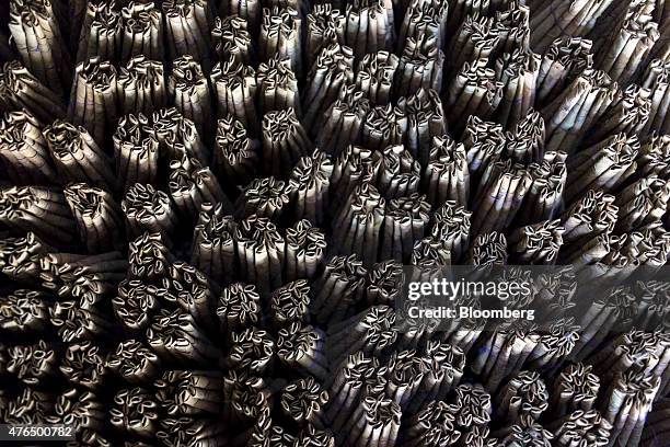 Bundles of bidi cigarettes sit in a tray at the Sarkar Bidi Factory in Kannauj, Uttar Pradesh, India, on Wednesday, June 3, 2015. India's smokers are...