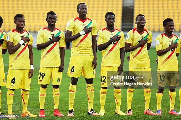 To R, Youssouf Kone of Mali of Mali, Adama Traore, Hamidou Maiga, Souleymane Coulibaly, Dieudonne Gbakle and Aboubacar Doumbia of Mali line up for...