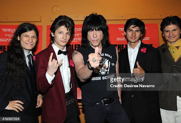 Musician Marky Ramone poses with "The Wolfpack" aka Angulo brothers at "The Wolfpack" New York Premiere at Sunshine Landmark on June 9, 2015 in New...