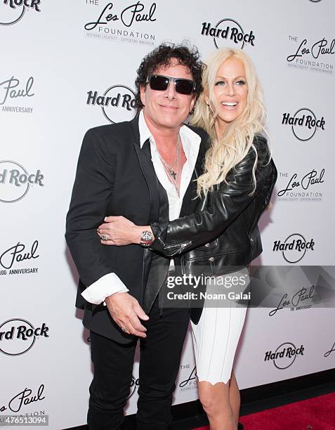 Neal Schon and Michaele Schon attend Les Paul's 100th anniversary celebration at Hard Rock Cafe - Times Square on June 9, 2015 in New York City.