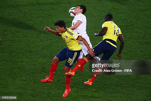 Rubio Rubin of USA jumps for a header with Victor Gutierrez and Davinson Sanchez of Colombia during the FIFA U-20 World Cup New Zealand 2015 Round of...